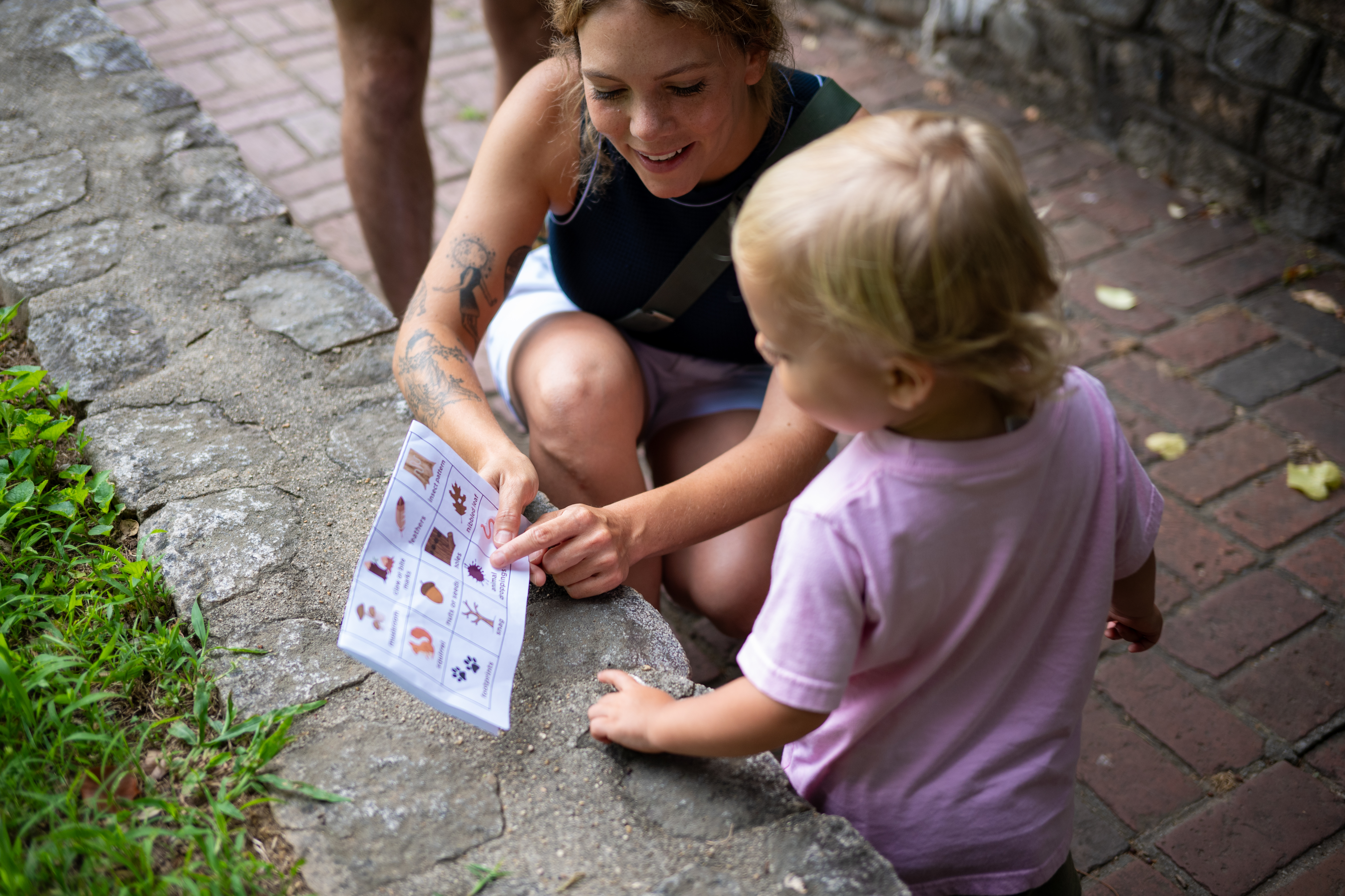 Theo Family - looking at scavenger hunt card
